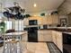 Bright kitchen with practical layout, light cabinets, and functional features for easy cooking at 1753 Tanner Cir, Henderson, NV 89012