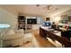 Bright living room boasts hardwood floors, built-in bookshelves, and a large desk at 1753 Tanner Cir, Henderson, NV 89012