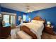 Stylish main bedroom with light hardwood floors, a large window, and plenty of natural light at 1753 Tanner Cir, Henderson, NV 89012