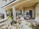 Covered patio with a glass block window, outdoor seating, and a view of the backyard at 1753 Tanner Cir, Henderson, NV 89012