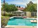 Community pool features a waterfall feature and lounge area, perfect for relaxation at 1753 Tanner Cir, Henderson, NV 89012