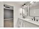 Bright bathroom features dual vanities with black fixtures and opens to the bedroom at 193 Jeri Dr, Henderson, NV 89074