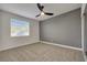 Bedroom with carpeted floors, a ceiling fan, a two-tone color scheme, and a window at 193 Jeri Dr, Henderson, NV 89074