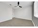 Bedroom with carpeted floors, a ceiling fan, and a light-colored wall at 193 Jeri Dr, Henderson, NV 89074
