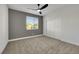 Bedroom with carpeted floors, a ceiling fan, and a double door closet at 193 Jeri Dr, Henderson, NV 89074