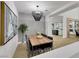 Dining area showcasing a wooden table with seating for six, stylish lighting, and contemporary artwork at 193 Jeri Dr, Henderson, NV 89074