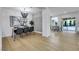 Bright dining area featuring modern light fixture, artwork, and access to patio with a view of the swimming pool at 193 Jeri Dr, Henderson, NV 89074