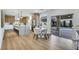 Modern kitchen with stainless steel appliances, marble countertops, dining area and pool views at 193 Jeri Dr, Henderson, NV 89074