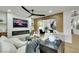 Comfortable living room area featuring a contemporary ceiling fan and sleek fireplace at 193 Jeri Dr, Henderson, NV 89074