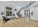 Bright living room featuring a soaring staircase, large windows, and contemporary decor at 193 Jeri Dr, Henderson, NV 89074