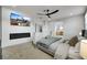 Inviting main bedroom with a fireplace, TV, neutral tones, and a view into the ensuite bathroom at 193 Jeri Dr, Henderson, NV 89074