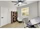 Bright office space with a stylish bookshelf, comfortable seating, and a modern ceiling fan at 193 Jeri Dr, Henderson, NV 89074
