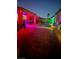 Cozy backyard oasis featuring a pool, patio, and vibrant lighting for evening relaxation and entertainment at 2092 Wildwood Lake Street, Henderson, NV 89052