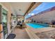 Inviting covered patio area perfect for outdoor dining, along with a sparkling pool to enjoy during the summer at 2092 Wildwood Lake Street, Henderson, NV 89052