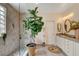 Bright bathroom features a glass-enclosed shower, double vanities, and elegant fixtures at 2092 Wildwood Lake Street, Henderson, NV 89052