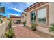 Cozy courtyard with brick patio and wrought iron table and chairs at 2092 Wildwood Lake Street, Henderson, NV 89052