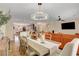 Open concept dining room and living room area with modern chandelier at 2092 Wildwood Lake Street, Henderson, NV 89052