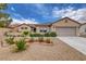 Charming single-story home with manicured low maintenance desert landscaping and brick-lined garden at 2092 Wildwood Lake Street, Henderson, NV 89052