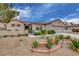 Charming single-story home with desert landscaping, a small garden and a gated courtyard at 2092 Wildwood Lake Street, Henderson, NV 89052