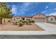 Charming single-story home features a low maintenance yard, desert landscaping, and a two car garage at 2092 Wildwood Lake Street, Henderson, NV 89052