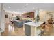 Spacious kitchen with island, breakfast bar, stainless appliances, and wood-look tile flooring at 2092 Wildwood Lake Street, Henderson, NV 89052