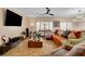 Open-concept living room with tile flooring, neutral walls, and plenty of seating options at 2092 Wildwood Lake Street, Henderson, NV 89052