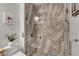 Luxurious shower stall showcasing elegant tile work, glass doors, and modern fixtures at 2092 Wildwood Lake Street, Henderson, NV 89052