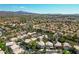 Aerial view of a residential community with a backdrop of mountains and clear blue skies at 2097 Eaglepath Cir, Henderson, NV 89074