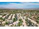 Aerial view showcasing a residential area with well-maintained homes and lush greenery at 2097 Eaglepath Cir, Henderson, NV 89074