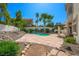 Private backyard with a pool, patio, and lush landscaping at 2097 Eaglepath Cir, Henderson, NV 89074
