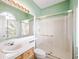 Well-lit bathroom featuring a shower, bathtub, and large mirror at 2097 Eaglepath Cir, Henderson, NV 89074