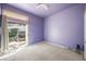 Bedroom with a sliding glass door and neutral carpet at 2097 Eaglepath Cir, Henderson, NV 89074