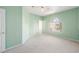 Bedroom featuring green walls, neutral carpet, and a sunlit window at 2097 Eaglepath Cir, Henderson, NV 89074