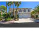 Charming two-story home featuring a spacious driveway and a manicured lawn, perfect for Gathering living and curb appeal at 2097 Eaglepath Cir, Henderson, NV 89074