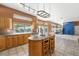 Spacious kitchen with island, tile floors, and backyard view at 2097 Eaglepath Cir, Henderson, NV 89074