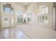 Spacious open-concept living area with lots of natural light, elegant chandeliers and a welcoming entrance at 2097 Eaglepath Cir, Henderson, NV 89074