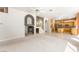 Spacious living area showcases the staircase and flows into the kitchen with natural lighting at 2097 Eaglepath Cir, Henderson, NV 89074