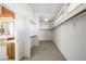 Walk-in closet with shelving and rod for hanging clothes at 2097 Eaglepath Cir, Henderson, NV 89074