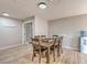 Dining room with seating for six and wood-look floors at 2129 N Michael Way, Las Vegas, NV 89108