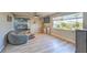 Bright, open living room featuring a large window and modern furnishings at 2129 N Michael Way, Las Vegas, NV 89108