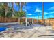 The backyard patio features a pergola with furniture, a grill, and a wooden fence at 2129 N Michael Way, Las Vegas, NV 89108