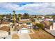Aerial view of a home in a residential neighborhood with mature trees and a two car garage at 2346 Roan Ave, Las Vegas, NV 89119