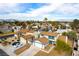 Aerial view of the home showcases the neighborhood and the Las Vegas skyline at 2346 Roan Ave, Las Vegas, NV 89119