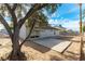 The backyard features a large patio area and a yard awaiting your personal touch at 2346 Roan Ave, Las Vegas, NV 89119