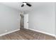 Simple bedroom featuring modern flooring, fresh paint, and a new ceiling fan at 2346 Roan Ave, Las Vegas, NV 89119