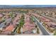 Scenic aerial shot of a vibrant community with well-maintained homes and desert landscaping at 2349 Orangeburg Pl, Henderson, NV 89044