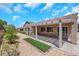 Back patio featuring a covered pergola with outdoor seating and desert landscaping at 2349 Orangeburg Pl, Henderson, NV 89044