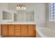Bright bathroom featuring a double vanity, tiled flooring, and a separate shower and tub at 2349 Orangeburg Pl, Henderson, NV 89044