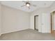 Spacious bedroom with carpet, ceiling fan, closet and ensuite bathroom at 2349 Orangeburg Pl, Henderson, NV 89044