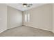 Neutral bedroom with carpet, a ceiling fan, and a window with shutters at 2349 Orangeburg Pl, Henderson, NV 89044